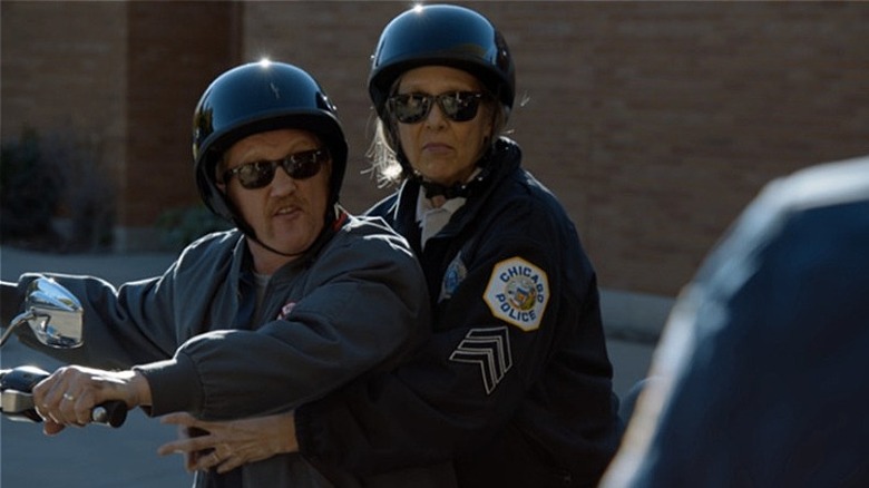 Mouch and Trudy together on a motorcycle