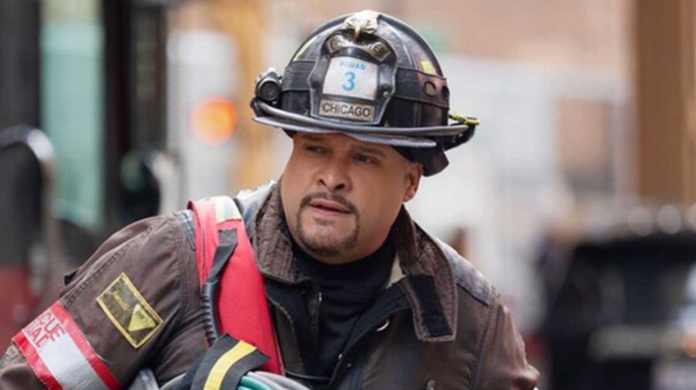 Cruz walking with a hose looped over his shoulder in "Chicago Fire" (2012-present)