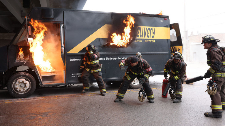 Firefighters extinguishing truck