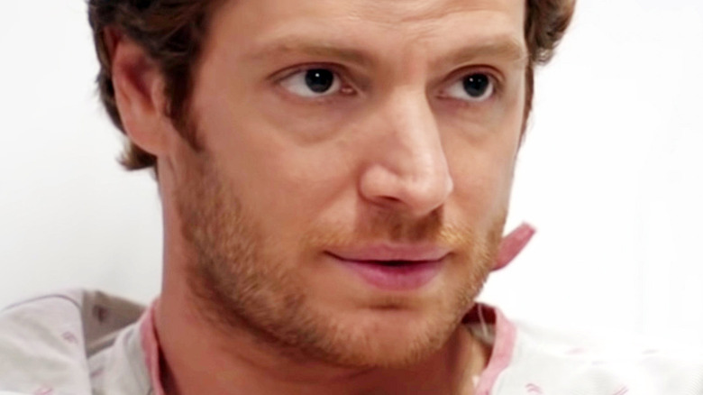 Nick Gehlfuss as Dr. Will Halstead in hospital bed in Chicago Med