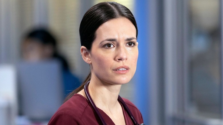 Dr. Natalie Manning in scrubs