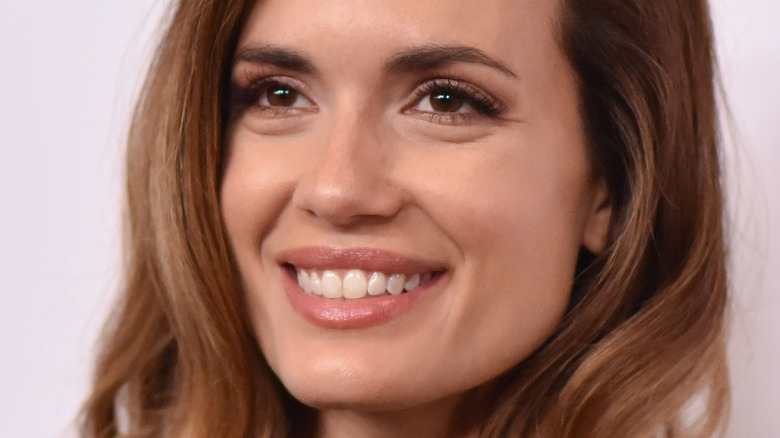 Torrey DeVitto smiling