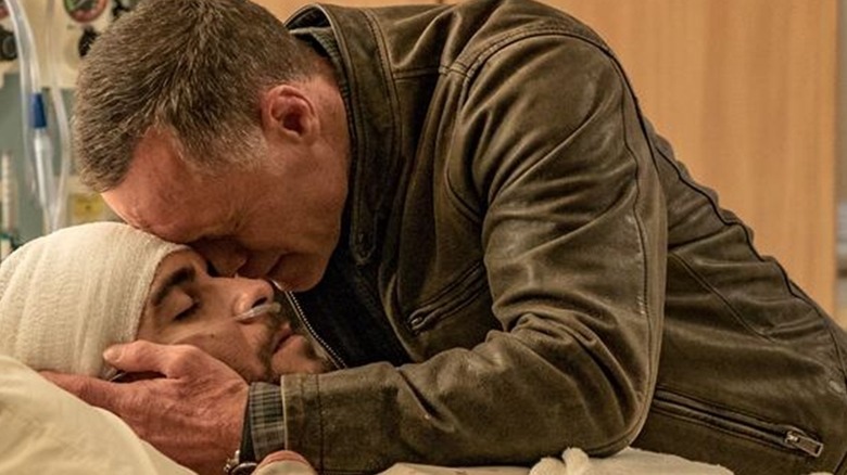 Jason Beghe cradling his dying son