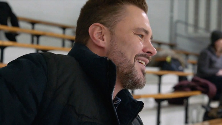 Adam Ruzek smiling at skating rink