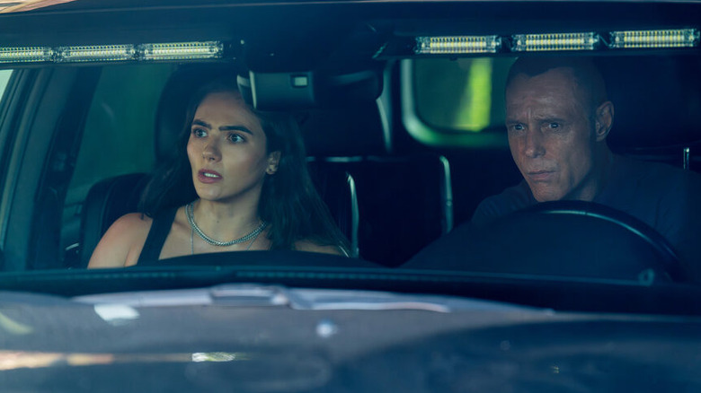 Eva Imani and Hank Voight in a police car in 