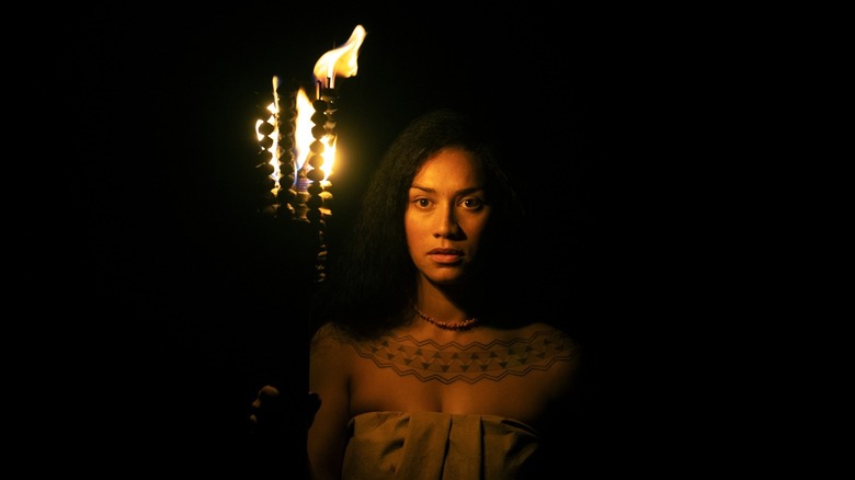 Ka'ahumanu holding a torch in the dark (2025)