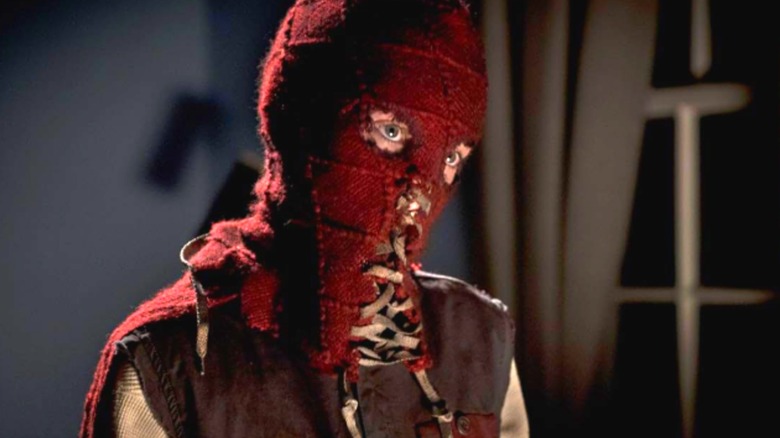 Brandon wearing a ragged, homemade red mask in Brightburn (2019)