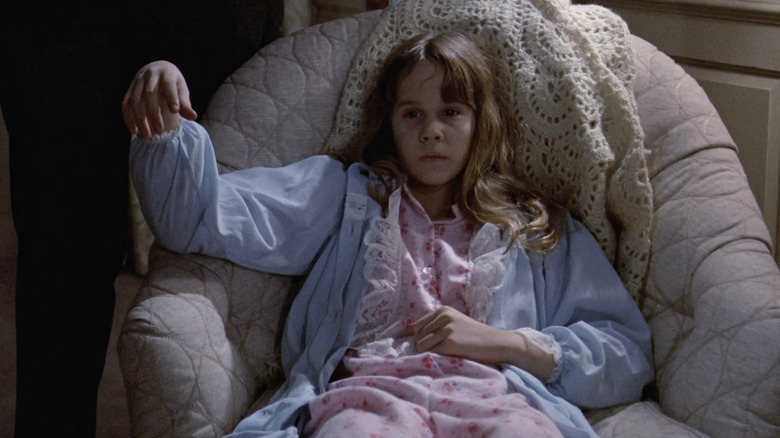 Regan looking weak in chair in The Exorcist (1973)