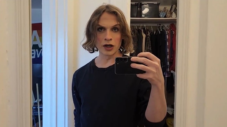 Alex Hood filming herself in a mirror