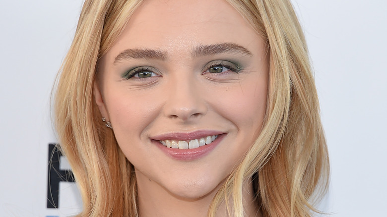 Chloe Grace Moretz smiles pleasantly