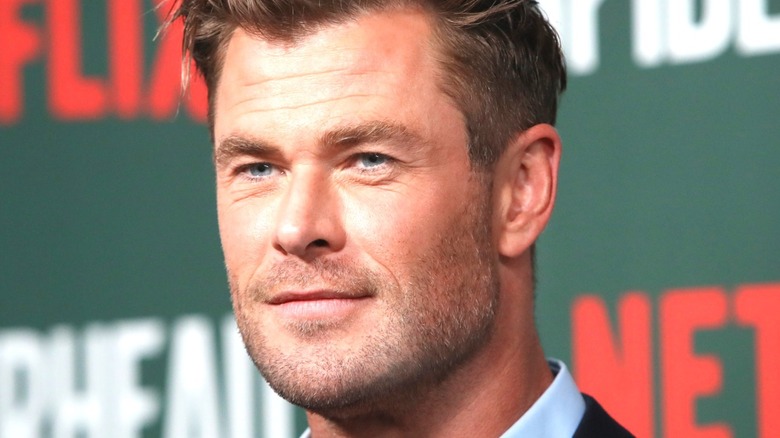 Chris Hemsworth smiles on Netflix Spiderhead red carpet