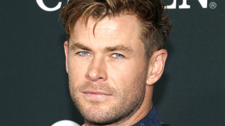 Chris Hemsworth looks at the camera