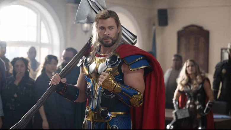 Thor holding hammer long hair
