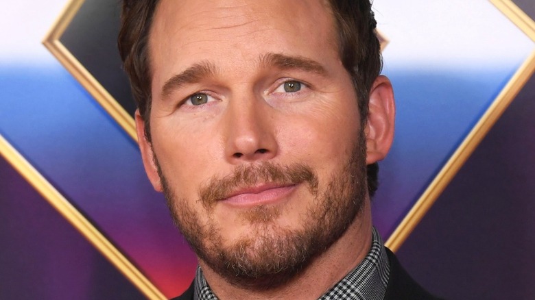 Chris Pratt posing on a red carpet