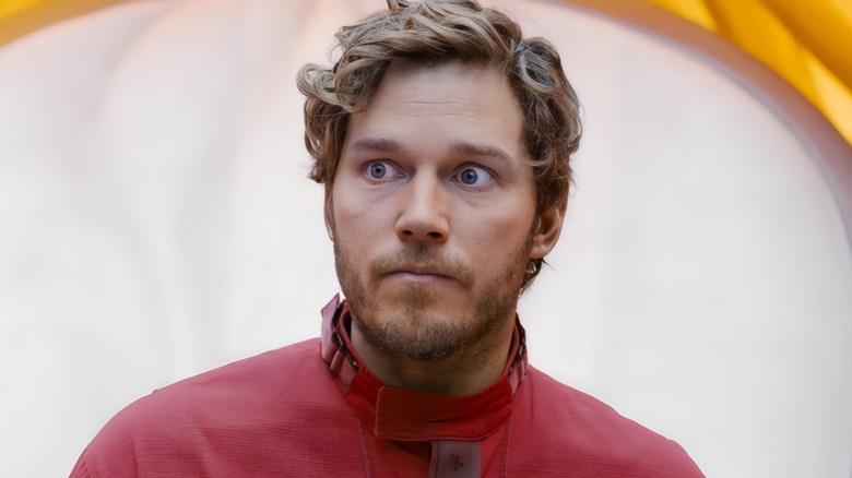 Star-Lord looks at something with wide eyes