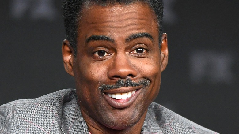 Chris Rock smirking