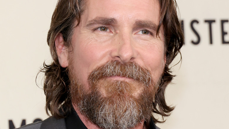Christian Bale looking on