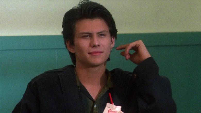 J.D. smirking at the lunch table in 