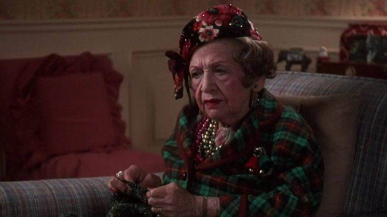 Aunt Bethany sitting on the couch knitting in National Lampoon's Christmas Vacation (1983)
