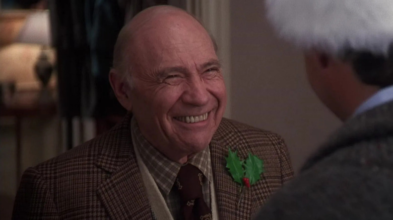 Clark Griswold Sr. smiling at his son in National Lampoon's Christmas Vacation (1983)