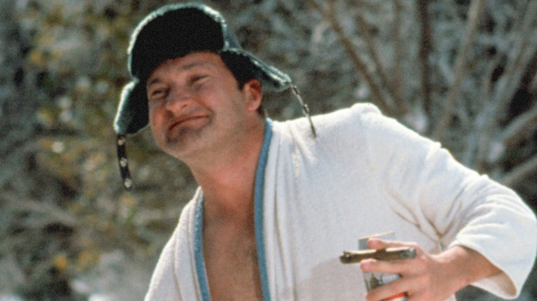 Cousin Eddie smiling in robe outside in National Lampoon's Christmas Vacation (1983)