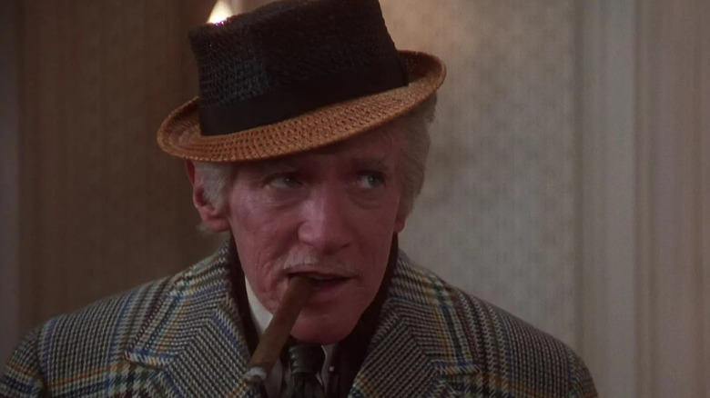 Uncle Lewis smoking cigar inside in National Lampoon's Christmas Vacation (1983)