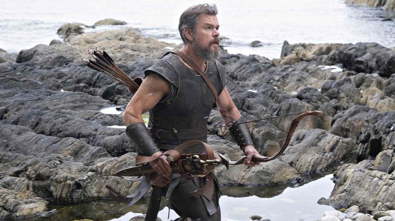 Odysseus running on the beach with his weapons in The Odyssey