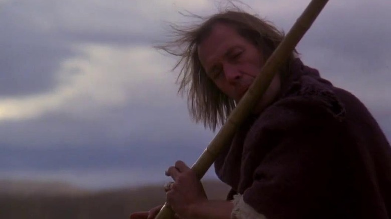 Chang-Sha playing a wood instrument in "Circle of Iron" (1978)