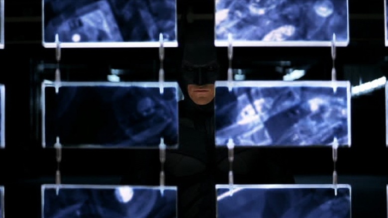 Batman looking at screens