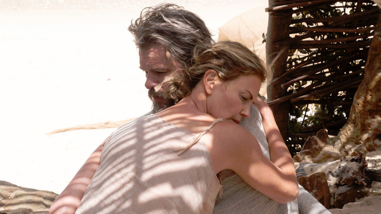 Odysseus and Calypso hugging in "The Odyssey" (2026)