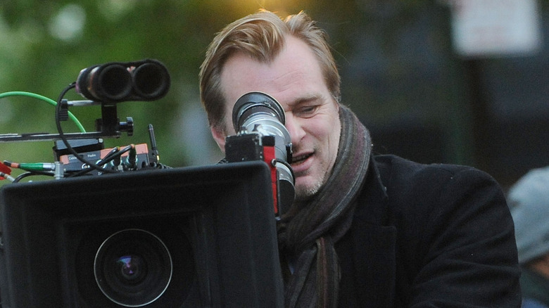 Christopher Nolan looking through camera