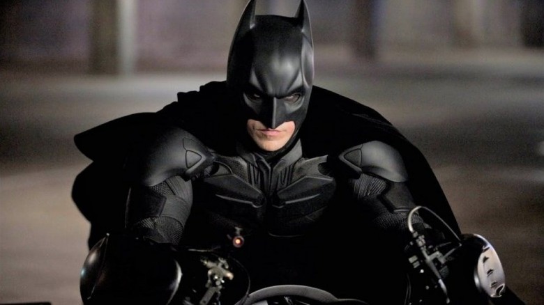 Batman riding the Batmobile in The Dark Knight