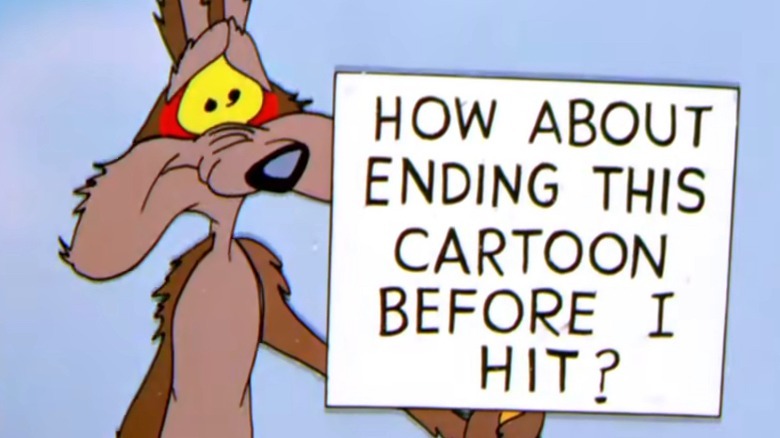 Wile E. Coyote looking sheepish holding a sign reading "How about ending this cartoon before I hit?"
