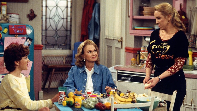 Grace Kelly stands at the breakfast table in 'Grace Under Fire'