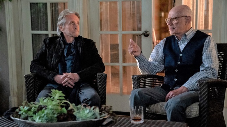Sandy and Norman sit in the backyard in 'The Kominsky Method'