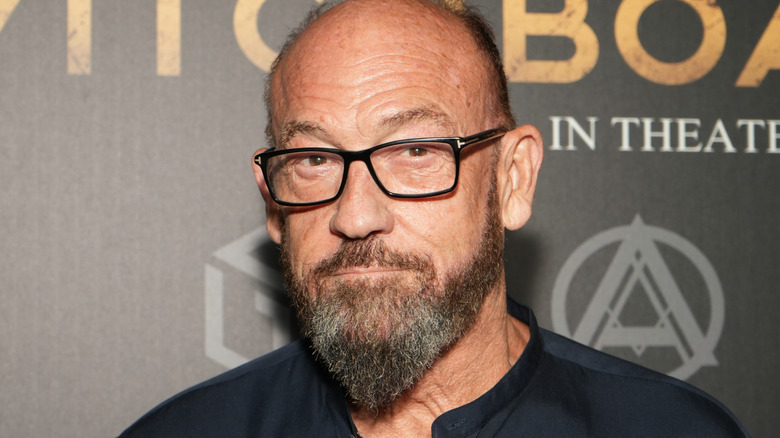 Chuck Russell posing at the premiere of "Witchboard" (2024)