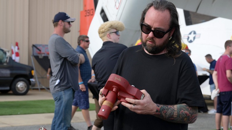 Chumlee inspecting something