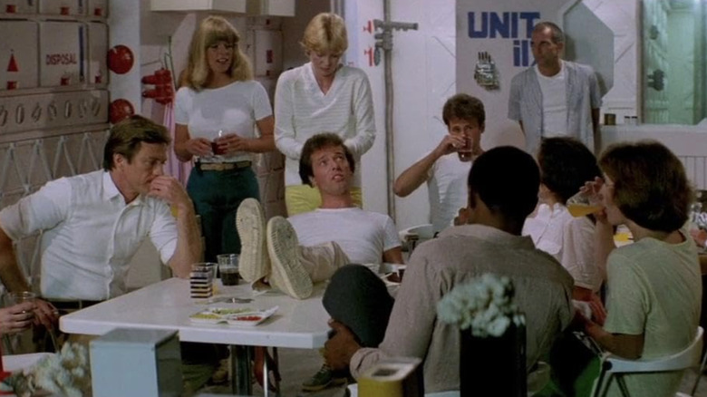 The Xeno Project team meet around a table in "Inseminoid" (1981)