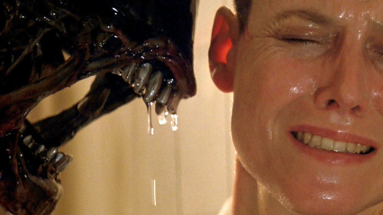 Ellen Ripley wincing away from a Xenomorph in Alien 3 (1992)