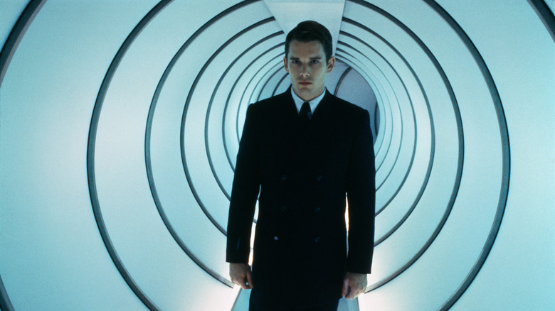 Vincent walking down a round, ringed passageway in Gattaca (1997)