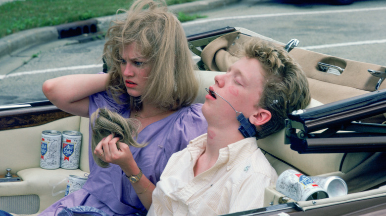 Ted and Caroline drunk in the back seat of a car in Sixteen Candles