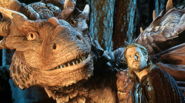 Drago and Sir Bowen looking over at a newcomer in Dragonheart (1996)