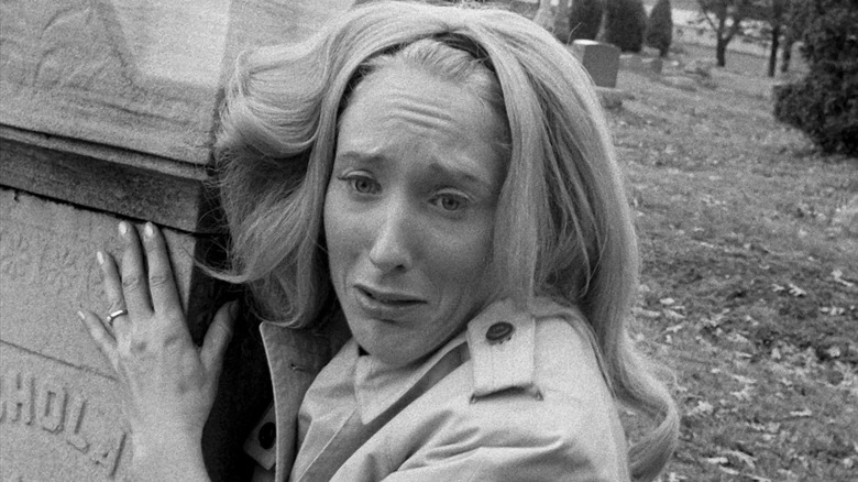 A terrified Barbara clinging to a grave stone in "Night of the Living Dead" (1968)