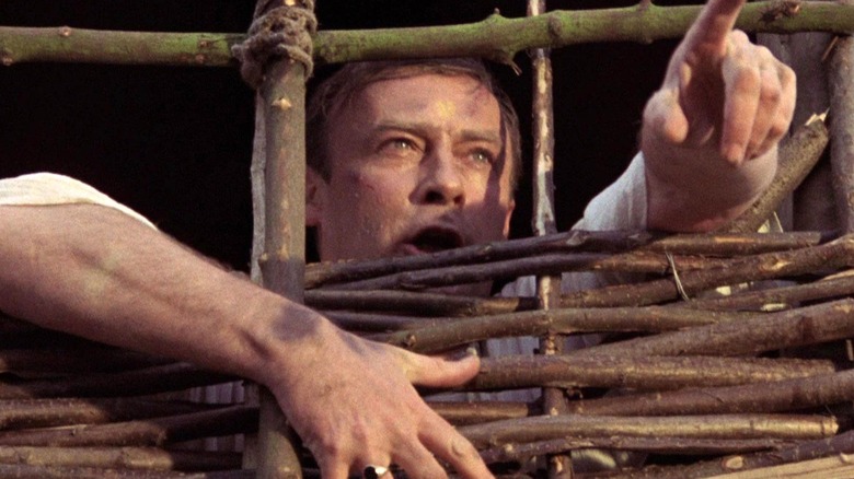 Sergeant Howie points and shouts from inside 