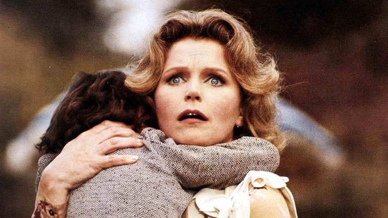Katherine Thorn holds Damien in "The Omen" (1976)