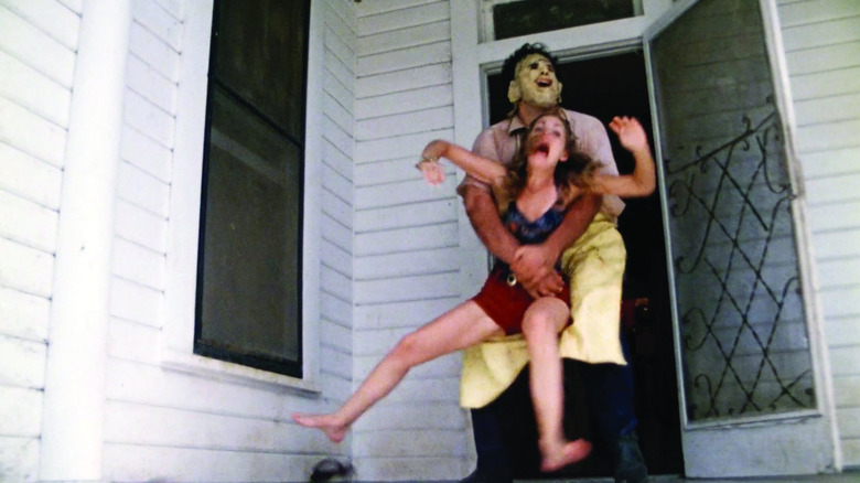 Leatherface grabs a victim in "The Texas Chain Saw Massacre" (1974)