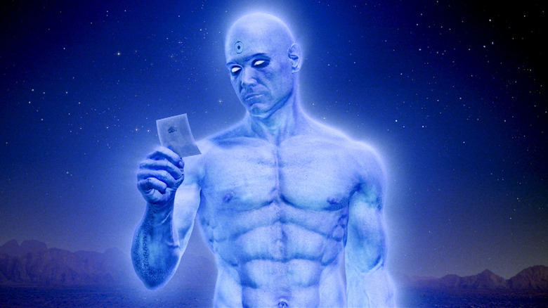 Doctor Manhattan looking at a photo in Watchmen (2009)