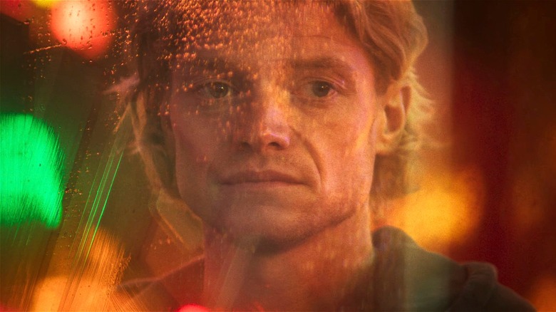 Matt Hagen looking through a dirty window in 