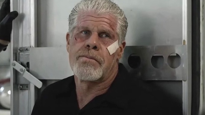 Clay Morrow with bandage on face