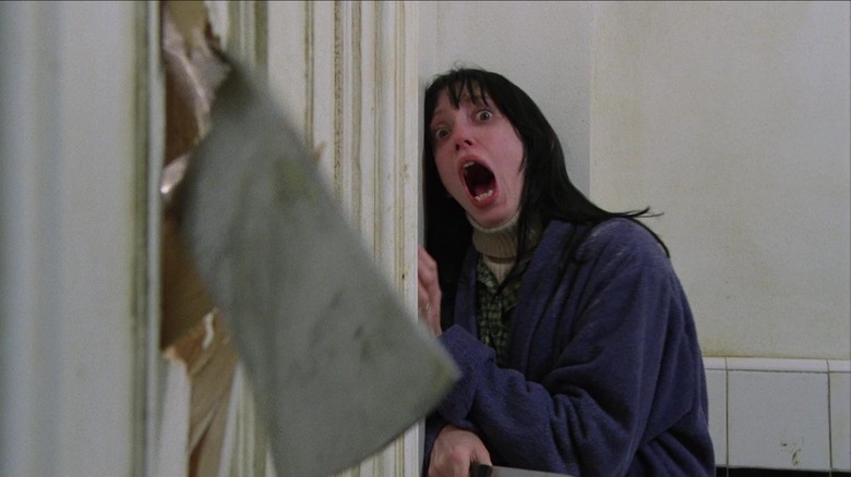 Wendy Torrence screaming as an axe breaks through bathroom door in 